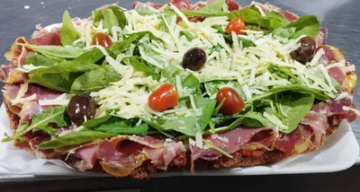 Milanesa con rúcula y jamón serrano super especial con guarnición